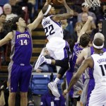 Phoenix Suns forward Luis Scola, left, of Argentina, blocks a shot by Sacramento Kings guard Isaiah Thomas (22) during the first quarter of an NBA basketball game in Sacramento, Calif., Wednesday, Jan. 23, 2013. (AP Photo/Rich Pedroncelli)