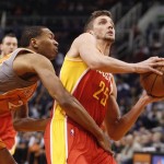 Houston Rockets forward Chandler Parsons, right, is fouled by Phoenix Suns forward Wesely Johnson, left, on a breakaway during the first half of an NBA basketball game Saturday, March 9, 2013, in Phoenix.(AP Photo/Paul Connors)
