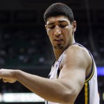 Utah Jazz's Enes Kanter reacts after dislocating his left shoulder during an NBA basketball game against the Phoenix Suns, Wednesday, March 27, 2013, in Salt Lake City. (AP Photo/The Deseret News, Scott G Winterton) 
