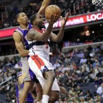 Washington Wizards forward Martell Webster (9) goes to the basket against Phoenix Suns forward Wesley Johnson, back, during the second half of an NBA basketball game, Saturday, March 16, 2013, in Washington. The Wizards won 127-105. (AP Photo/Nick Wass)
