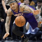 Phoenix Suns' Michael Beasley goes after a loose ball during the second half of an NBA basketball game against the Memphis Grizzlies in Memphis, Tenn., Tuesday, Feb. 5, 2013. The Suns defeated the Grizzlies 96-90. (AP Photo/Danny Johnston)