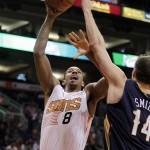 
Phoenix Suns forward Channing Frye (8) scores against New Orleans Pelicans center Jason Smith (14) in the third quarter during an NBA basketball game on Sunday, Nov. 10, 2013, in Phoenix. The Suns defeated the Pelicans 101-94. (AP Photo/Rick Scuteri)