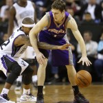 Phoenix Suns guard Goran Dragic, of Slovenia, right, protects the ball from Sacramento Kings guard Isaiah Thomas during the fourth quarter of an NBA basketball game in Sacramento, Calif., Wednesday, Jan. 23, 2013. The Suns won 106-96.(AP Photo/Rich Pedroncelli)