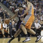 Sacramento Kings center DeMarcus Cousins, left, drives against Phoenix Suns center Hamed Haddadi, of Iran, during the fourth quarter of an NBA basketball game in Sacramento, Calif., Friday, March 8, 2013. The Kings won 121-112. (AP Photo/Rich Pedroncelli)