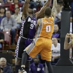 Sacramento Kings forward Patrick Patterson, left, blocks the shot of Phoenix Suns forward Michael Beasley during the fourth quarter of an NBA basketball game in Sacramento, Calif., Friday, March 8, 2013. The Kings won 121-112. (AP Photo/Rich Pedroncelli)