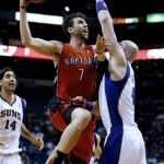 Toronto Raptors' Andrea Bargnani (7), of Italy, shoots over Phoenix Suns' Marcin Gortat, of Poland, during the first half of an NBA basketball game, Wednesday, March 6, 2013, in Phoenix. (AP Photo/Matt York)