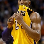 Los Angeles Lakers' Kobe Bryant looks at the crowd during a timeout against the Phoenix Suns during the first half on an NBA basketball game, Wednesday, Jan. 30, 2013, in Phoenix. (AP Photo/Matt York)