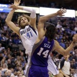 Dallas Mavericks forward Dirk Nowitzki (41), of Germany, is fouled by Phoenix Suns forward Luis Scola (14), of Argentina, during the second half of an NBA basketball game, Wednesday, April 10, 2013, in Dallas. The Suns won 102-91. (AP Photo/LM Otero)