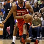 Washington Wizards' Trevor Ariza (1) drives against the Phoenix Suns during the first half of an NBA basketball game on Wednesday, March 20, 2013, in Phoenix. (AP Photo/Matt York)