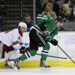  Phoenix Coyotes' Tim Kennedy (34) and Dallas Stars' Valeri Nichushkin (43) chase after a loose puck in the second period of an NHL hockey game, Saturday, Feb. 8, 2014, in Dallas. (AP Photo/Tony Gutierrez)
