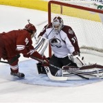Colorado Avalanche's Jean-Sebastien Giguere (35) makes a save on a shot by Phoenix Coyotes' Antoine Vermette (50) during the first period in an NHL hockey game, on Friday, April 26, 2013, in Glendale, Ariz. (AP Photo/Ross D. Franklin)