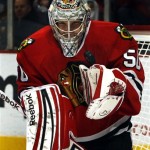 Chicago Blackhawks' goalie Corey Crawford stops a shot by Phoenix Coyotes' Radim Vrbata during the first period of an NHL hockey game on Saturday, Apr. 20, 2013, in Chicago. (AP Photo/John Smierciak)