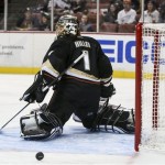 Anaheim Ducks goalie Jonas Hiller, of Switzerland, looks for the puck after making a save during the first period of an NHL hockey game against the Phoenix Coyotes, Wednesday, March 6, 2013, in Anaheim, Calif. (AP Photo/Bret Hartman)