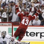 Phoenix Coyotes' Marc-Antoine Pouliot (43) celebrates his goal against Los Angeles Kings' Jonathan Quick (32) in the second period during Game 5 of the NHL hockey Stanley Cup Western Conference finals, Tuesday, May 22, 2012, in Glendale, Ariz. (AP Photo/Ross D. Franklin)