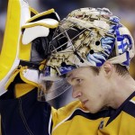 Nashville Predators goalie Pekka Rinne, of Finland, pulls on his mask during a stop in play in the third period of an NHL hockey game against the Phoenix Coyotes, Thursday, Feb. 14, 2013, in Nashville, Tenn. The Predators won 3-0. (AP Photo/Mark Humphrey)