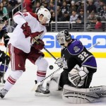 Los Angeles Kings goalie Jonathan Quick (32) stops a shot from Phoenix Coyotes center Lauri Korpikoski, left, of Finland, during the third period of an NHL hockey game, Monday, March 18, 2013, in Los Angeles. The Kings won 4-0. (AP Photo/Gus Ruelas)