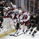 Phoenix Coyotes right wing Nick Johnson, middle, clears the puck up the ice past Anaheim Ducks defenseman Luca Sbisa, of Italy, during the first period of an NHL hockey game, Wednesday, March 6, 2013, in Anaheim, Calif. (AP Photo/Bret Hartman)
