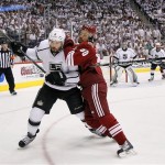 Phoenix Coyotes center Antoine Vermette, right, checks into Los Angeles Kings defenseman Drew Doughty (8) during the first period of Game 2 of the NHL hockey Stanley Cup Western Conference finals, Tuesday, May 15, 2012, in Glendale, Ariz. (AP Photo/Matt York)