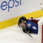 
Colorado Avalanche center Matt Duchene (9) watches the puck bounce away after being knocked down by Phoenix Coyotes defenseman Zbynek Michalek, of Czech Republic, during the third period of an NHL hockey game in Denver on Tuesday, Dec. 10, 2013. Phoenix won 3-1. (AP Photo/Joe Mahoney)
