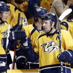 Nashville Predators center Mike Fisher, right, is congratulated by defenseman Roman Josi (59), of Switzerland, after scoring against the Phoenix Coyotes in the third period of an NHL hockey game, Thursday, Feb. 14, 2013, in Nashville, Tenn. The Predators won 3-0. (AP Photo/Mark Humphrey)