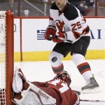  New Jersey Devils' Ryane Clowe (29) watches the puck bounce off the net and over Phoenix Coyotes' Mike Smith after scoring a goal during the first period of an NHL hockey game on Saturday, Jan. 18, 2014, in Glendale, Ariz. (AP Photo/Ross D. Franklin)