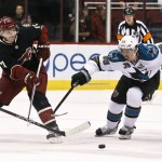 Phoenix Coyotes' Radim Vrbata (17), of the Czech Republic, gets a pass off in front of San Jose Sharks' Logan Couture (39) in the first period during an NHL hockey game, on Monday, April 15, 2013 in Glendale, Ariz. (AP Photo/Ross D. Franklin)