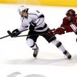 Los Angeles Kings defenseman Drew Doughty (8) battles Phoenix Coyotes left wing Ray Whitney (13) for the puck during the first period of Game 2 of the NHL hockey Stanley Cup Western Conference finals, Tuesday, May 15, 2012, in Glendale, Ariz. (AP Photo/Ross D. Franklin)
