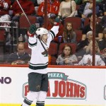 Minnesota Wild's Justin Fontaine celebrates his third goal of the night against the Phoenix Coyotes, for a hat trick, during the third period in an NHL hockey game Thursday, Jan. 9, 2014, in Glendale, Ariz. The Wild defeated the Coyotes 4-1. (AP Photo/Ross D. Franklin)