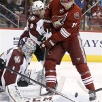  Phoenix Coyotes' Martin Hanzal (11), of Czech Republic, battle with Colorado Avalanche's Jan Hejda (8), of Czech Republic, for the puck in front of Avalanche goalie Semyon Varlamov (1), of Russia, during the second period of an NHL hockey game Thursday, Nov. 21, 2013, in Glendale, Ariz. (AP Photo/Ross D. Franklin)