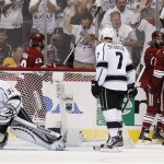 Phoenix Coyotes' Keith Yandle, third from right, celebrates his goal against Los Angeles Kings goalie Jonathan Quick (32) with teammates Lauri Korpikoski (28), of Finland, and Taylor Pyatt, rear right, as Daymond Langkow (22) skates in to join while Kings' Rob Scuderi (7) looks down at the puck in the second period during Game 5 of the NHL hockey Stanley Cup Western Conference finals, Tuesday, May 22, 2012, in Glendale, Ariz. (AP Photo/Ross D. Franklin)