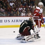 Phoenix Coyotes goalie Jason LaBarbera (1) gives up a goal to Detroit Red Wings' Ian White, not shown, as Joakim Andersson (63), of Sweden, skates in front of the net in the first period during an NHL hockey game, Monday, March 25, 2013, in Glendale, Ariz. (AP Photo/Ross D. Franklin)