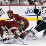 Los Angeles Kings' Mike Richards (10) scores against Phoenix Coyotes goalie Mike Smith, left, as Rostislav Klesla (16), of the Czech Republic, slides in late to defend in the second period during Game 5 of the NHL hockey Stanley Cup Western Conference finals, Tuesday, May 22, 2012, in Glendale, Ariz. (AP Photo/Ross D. Franklin)
