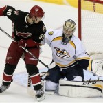 Nashville Predators goalie Pekka Rinne (35) of Finland, makes the save in front of Phoenix Coyotes center Antoine Vermette (50) in the third period during an NHL hockey game on Monday, Jan. 28, 2013, in Glendale, Ariz. (AP Photo/Rick Scuteri)