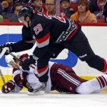 Carolina Hurricanes' Alexander Semin (28) of Russia, collides with Phoenix Coyotes' Martin Hanzal (11) of Czech Republic, during the second period of an NHL hockey game, Sunday, Oct. 13, 2013, in Raleigh, N.C. (AP Photo/Karl B DeBlaker)