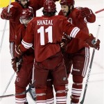 Phoenix Coyotes left wing Taylor Pyatt (14) celebrates his goal with Martin Hanzal (11), Radim Vrbata, center, and Keith Yandle (3) during the first period of Game 5 of the NHL hockey Stanley Cup Western Conference finals, Tuesday, May 22, 2012, in Glendale, Ariz. (AP Photo/Ross D. Franklin)