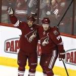 Phoenix Coyotes' Steve Sullivan, left, celebrates his hat trick against the Columbus Blue Jackets with teammate Shane Doan (19) during the third period in an NHL hockey game Wednesday, Jan. 23, 2013, in Glendale, Ariz. The Coyotes defeated the Blue Jackets 5-1.(AP Photo/Ross D. Franklin)