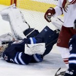 Phoenix Coyotes' Oliver Ekman-Larsson (23), not shown, shoots the puck over Winnipeg Jets' goaltender Ondrej Pavelec (31) and into the open net during first period NHL hockey action in Winnipeg, Monday, Jan. 13, 2014. (AP Photo/The Canadian Press, Trevor Hagan)