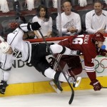 Phoenix Coyotes defenseman Rostislav Klesla, right, checks Los Angeles Kings center Jeff Carter (77) into the boards during the first period of Game 2 of the NHL hockey Stanley Cup Western Conference finals, Tuesday, May 15, 2012, in Glendale, Ariz. (AP Photo/Ross D. Franklin)