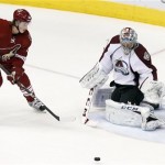  Colorado Avalanche's Semyon Varlamov, right, of Russia, makes a save on a shot by Phoenix Coyotes' Tim Kennedy (34) during the first period of an NHL hockey game Thursday, Nov. 21, 2013, in Glendale, Ariz. (AP Photo/Ross D. Franklin)