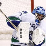 Vancouver Canucks' Roberto Luongo makes a save on a shot by the Phoenix Coyotes during the second period of an NHL hockey game on Tuesday, Nov. 5, 2013, in Glendale, Ariz. (AP Photo/Ross D. Franklin)