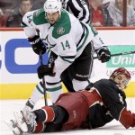  Phoenix Coyotes' Antoine Vermette, right, slides in front of Dallas Stars' Jamie Benn (14) to stop him from getting a shot off during the first period of an NHL hockey game, Tuesday, Feb. 4, 2014, in Glendale, Ariz. (AP Photo/Ross D. Franklin)
