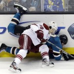 Phoenix Coyotes center Antoine Vermette (50) collides against San Jose Sharks right wing Ryane Clowe against the boards during overtime of an NHL hockey game in San Jose, Calif., Saturday, Feb. 9, 2013. Phoenix won 1-0 in a shootout. (AP Photo/Marcio Jose Sanchez)
