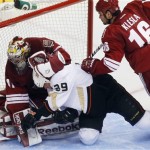 Phoenix Coyotes goalie Mike Smith (41) takes down Anaheim Ducks left wing Matt Beleskey (39) in the third period during an NHL hockey game Saturday, March 2, 2013, in Glendale, Ariz. Phoenix won 5-4 in a shootout. (AP Photo/Rick Scuteri)