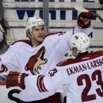 Phoenix Coyotes' Antoine Vermette, left, celebrates his third goal against the Vancouver Canucks with teammate Oliver Ekman-Larsson, of Sweden, during the second period of an NHL hockey game in Vancouver, British Columbia, on Sunday, Jan. 26, 2014. (AP Photo/The Canadian Press, Darryl Dyck)