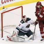 Minnesota Wild's Niklas Backstrom, left, of Finland, makes a save on a shot as Phoenix Coyotes' Martin Hanzal (11), of the Czech Republic, waits for a possible rebound during the second period in an NHL hockey game, Thursday, Jan. 9, 2014, in Glendale, Ariz. (AP Photo/Ross D. Franklin)
