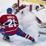 Montreal Canadiens' Brian Gionta sprays ice onto Phoenix Coyotes goalie Mike Smith during the second period of an NHL hockey game Tuesday, Dec. 17, 2013, in Montreal. (AP Photo/The Canadian Press, Paul Chiasson)