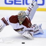 Phoenix Coyotes goalkeeper Thomas Greiss (1) dives to make a save against Los Angeles Kings during the second period of an NHL hockey game at the Staples Center Sunday, April 15, 2013., in Los Angeles. (AP Photo/Kevork Djansezian)
