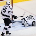 Los Angeles Kings goalie Jonathan Quick (32) lies face down after giving up a goal against the Phoenix Coyotes during the second period of Game 5 of the NHL hockey Stanley Cup Western Conference finals, Tuesday, May 22, 2012, in Glendale, Ariz. At left is Slava Voynov (26). (AP Photo/Matt York)