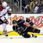 Los Angeles Kings right wing Justin Williams, right, falls as he tries to 
pass the puck as Phoenix Coyotes defenseman Michal Rozsival, of the 
Czech Republic, looks on during the second period in Game 4 of the 
NHL hockey Stanley Cup Western Conference finals, Sunday, May 20, 
2012, in Los Angeles. (AP Photo/Mark J. Terrill)