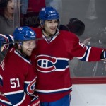 Montreal Canadiens' Max Pacioretty, right, celebrates his goal against the Phoenix Coyotes with teammate David Desharnais during the third period of an NHL hockey game Tuesday, Dec. 17, 2013, in Montreal. Montreal won 3-1. (AP Photo/The Canadian Press, Paul Chiasson)